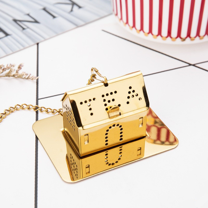 House shaped stainless steel tea infuser in various metallic finishes House shaped stainless steel tea infuser in various metallic finishes