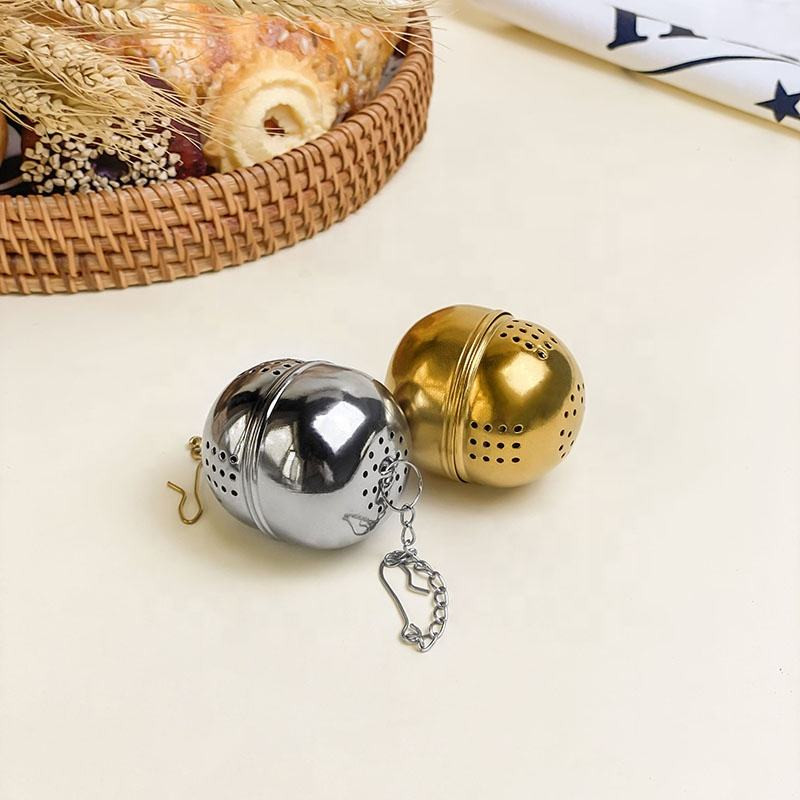 Tea Infuser Egg Ball with matching drip tray catching tea drips Tea Infuser Egg Ball with matching drip tray catching tea drips