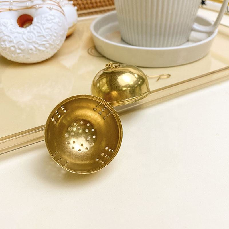 Tea Infuser Egg Ball with matching drip tray catching tea drips Tea Infuser Egg Ball with matching drip tray catching tea drips