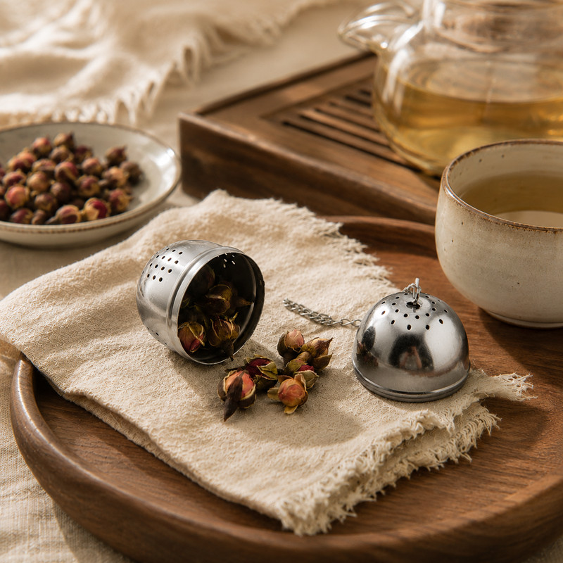 Tea Infuser Egg Ball with matching drip tray catching tea drips Tea Infuser Egg Ball with matching drip tray catching tea drips