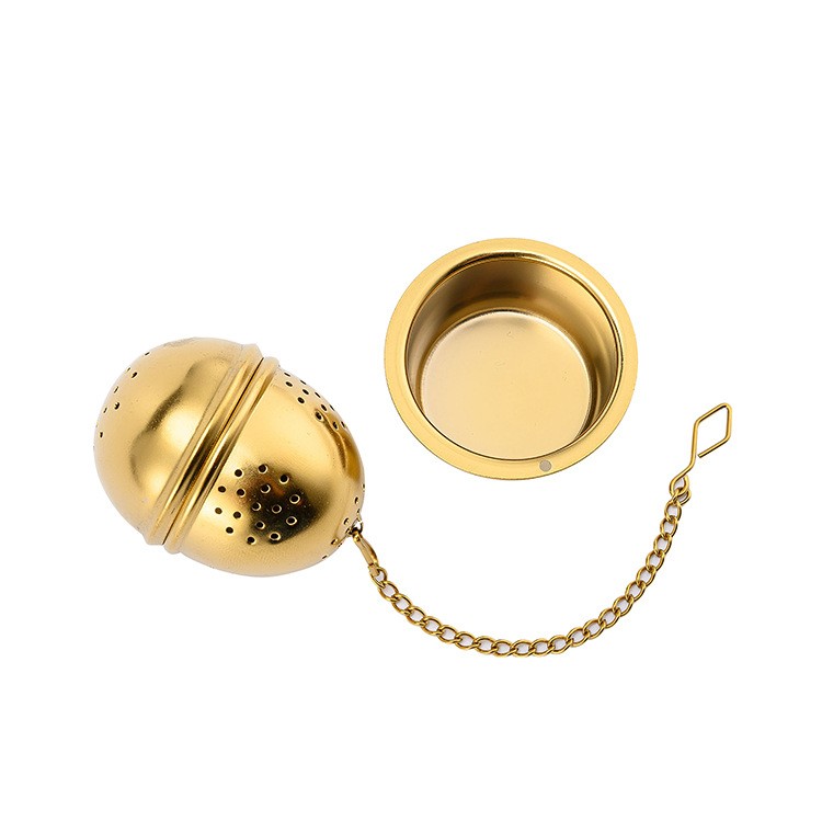 Tea Infuser Egg Ball with matching drip tray catching tea drips Tea Infuser Egg Ball with matching drip tray catching tea drips