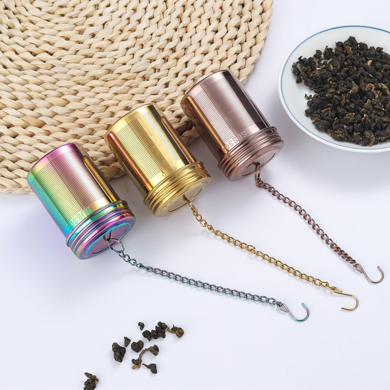 Stainless steel cylinder tea infuser basket with chain in rainbow, gold, and rose gold colors for loose leaf tea Stainless steel cylinder tea infuser basket with chain in rainbow, gold, and rose gold colors for loose leaf tea