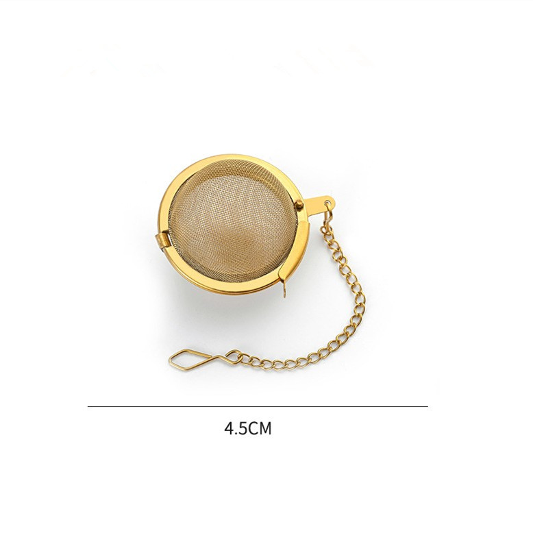Gold tea infuser with fine mesh basket and decorative chain Gold tea infuser with fine mesh basket and decorative chain